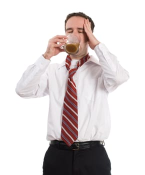 A young coffee adict solving his caffeine headache by drinking another cup of coffee, isolated against a white background