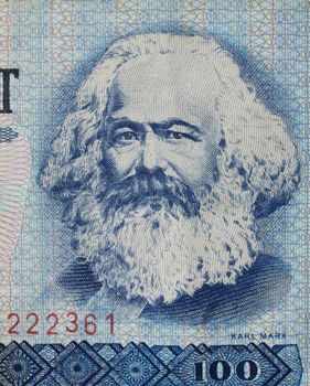 100 Mark banknote from the DDR (East Germany) with Karl Marx with 1 Mark coin - Note: no more in use since german reunification in 1989