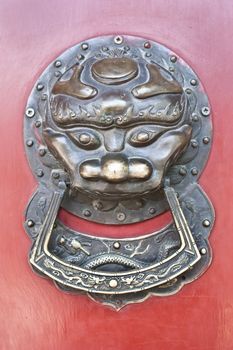 Red door in hutong area, close to Forbidden City, Beijing, China