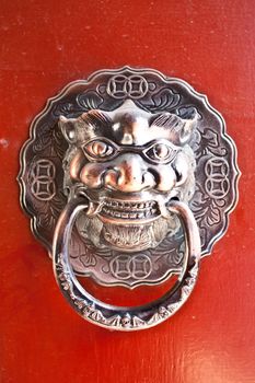 Red door in hutong area, close to Forbidden City, Beijing, China