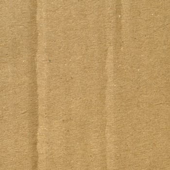Brown grunge corrugated cardboard sheet useful as a background