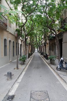 I empty street with closed stores on either side