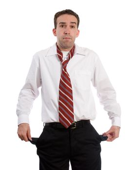 An unemployed man holding out his empty pockets, isolated against a white background