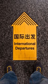 Sign of international departures in a Chinese airport, good for conceptual