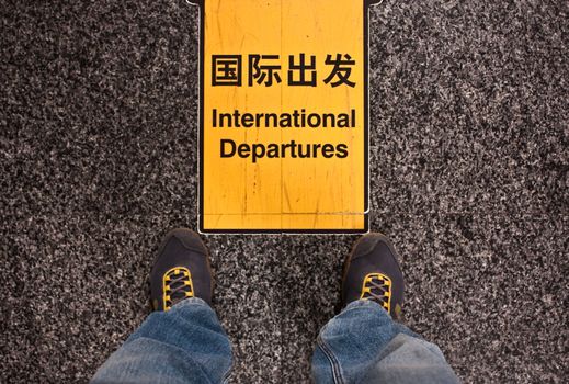 Sign of international departures in a Chinese airport, good for conceptual