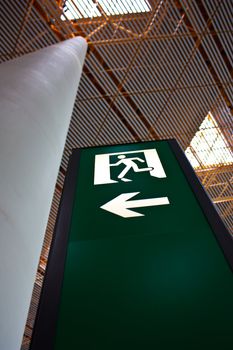 Sign of emergency exit in a Chinese airport, good for conceptual