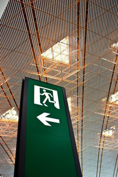 Sign of emergency exit in a Chinese airport, good for conceptual