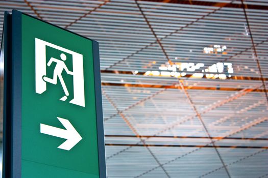 Sign of emergency exit in a Chinese airport, good for conceptual