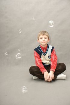 young boy with book in white background