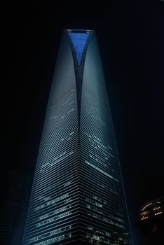 shanghai pudong world financial center and jin mao tower illuminated by night