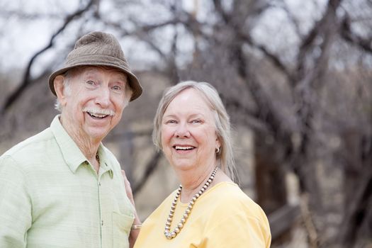 Portrait of happy senior couple in outdoor setting