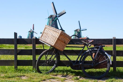 Clear and traditional landmark for Holland: bicycle and mills