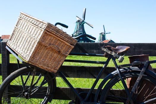 Clear and traditional landmark for Holland: bicycle and mills