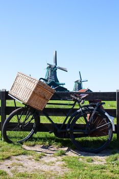 Clear and traditional landmark for Holland: bicycle and mills