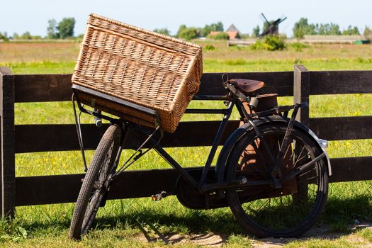Clear and traditional landmark for Holland: bicycle and mills