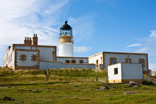 Lighthouse in Sutherland, Scotland, close to cliffs