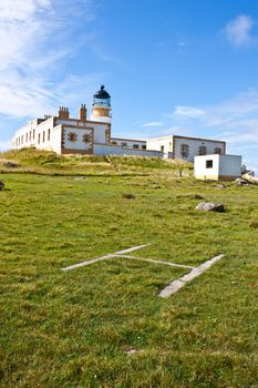 Helicopter platform close to lighthouse in Scotland