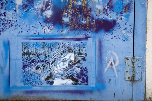 Graffiti People and blue door - Brick Lane. London 2008