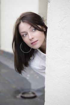 portrait of surprised young adorable woman wearing white coat