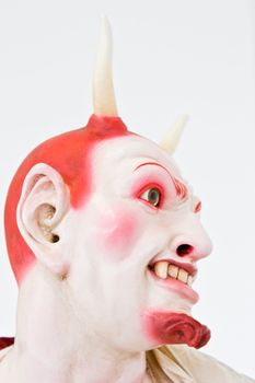 Demon face on white, close detail, focus on eyes