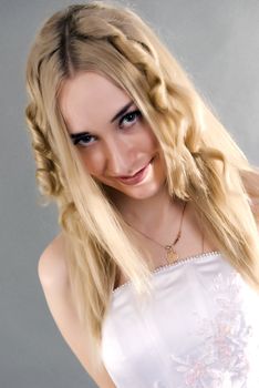 Young beautiful smiling  bride  with blond hair 