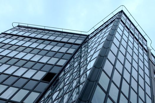 Part of a modern office building against the sky