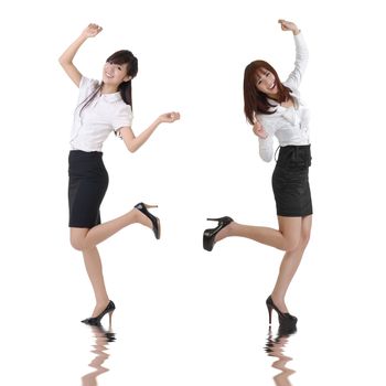Happy business women dancing over white background.