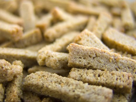 Dry black bread, on a macro for background