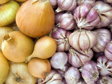 Agricultural background, a pile of beautiful bulb onions and garlic