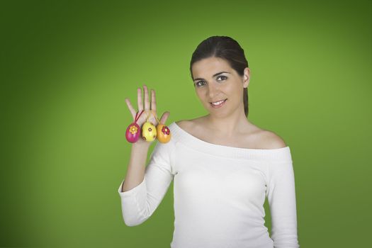 Beautiful easter woman portraits with eggs on the right hand