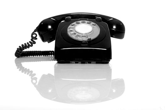 Vintage phone on a white background with reflection