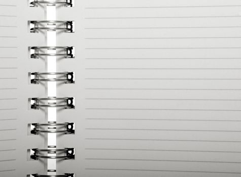 An open Spiral note book with lines
