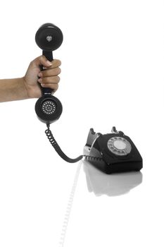 Male hand holding an hold vintage phone