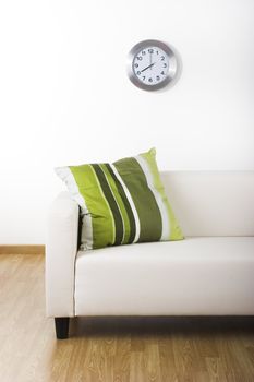 Nice home with a beautiful couch and a green pillow