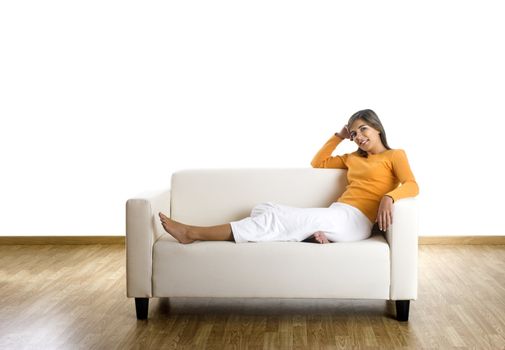 Beautiful woman relaxing on the couch at home