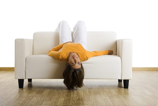 Beautiful woman laughing on the couch at home