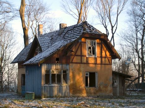 Old rural damaged house in romanesque style (Prussia architecture)