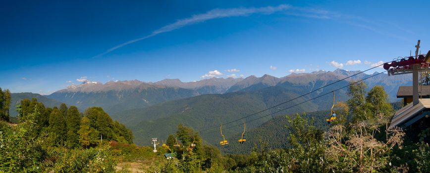 Cableway to Aibga Peak at Krasnaya Poluana near Sochi in Russia. The resort is slated to host the snow events (alpine and nordic) of the 2014 Winter Olympics in Sochi. Panoramic image stitched from 5 vertical shots.