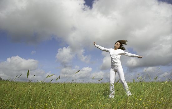 Beautiful happy woman having fun in the nature