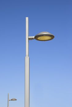 Picture of a modern street lantern with a blue sky in the background