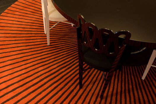 stripped rug with table and chairs