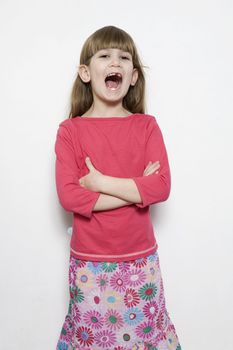 portrait of young smiling cute singing  girl seven years old.  