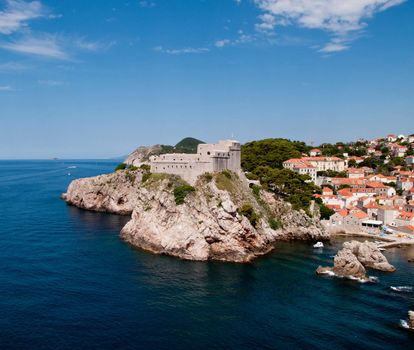 Ancient fortress on the cliff edge of Dubrovnik protects the port