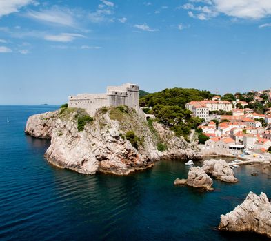 Ancient fortress on the cliff edge of Dubrovnik protects the port