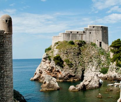 Ancient fortress on the cliff edge of Dubrovnik protects the port