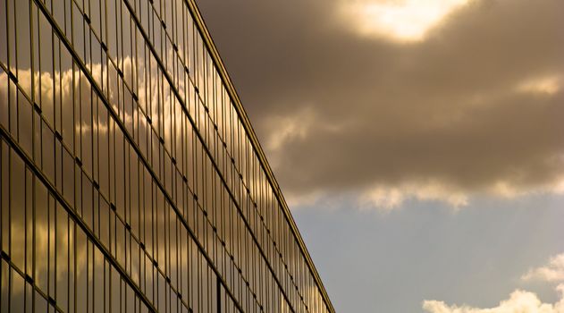 Glass modern building at sunset