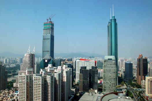 SHENZHEN, CHINA - OCTOBER 31: Two, highest skyscrapers in Shenzhen on October 31, 2010. Shun Hing Square, named also as DiWang - 384 meters and Kingkey Finance Tower � 441 meters, still under construction.