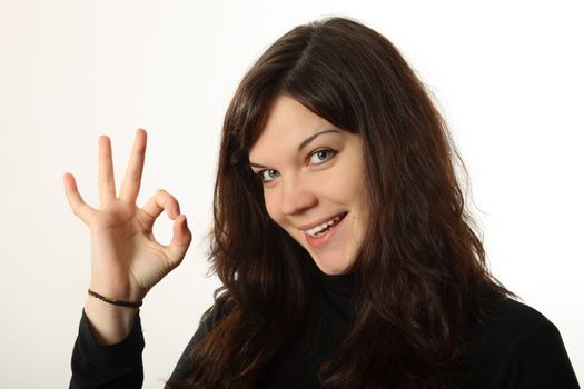 The beautiful, emotional girl on a white background