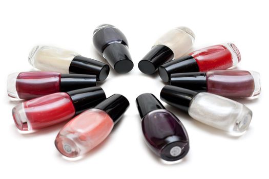 Vials colour varnish nailwaer, make-up insulated on white background