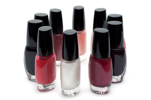 Vials colour varnish nailwaer, make-up insulated on white background